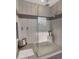 Bathroom featuring a shower, neutral-colored walls, and decorative tile at 3882 E Andalusia Ave, Gilbert, AZ 85298