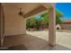 Covered back patio with stucco fireplace and ample room for seating and entertaining outdoors at 4286 E Buckboard Rd, Gilbert, AZ 85297