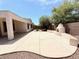 Spacious backyard with an outdoor kitchen featuring a unique oven perfect for entertaining guests at 4286 E Buckboard Rd, Gilbert, AZ 85297