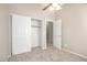 Neutral carpeted bedroom featuring a closet and a door to another room at 4286 E Buckboard Rd, Gilbert, AZ 85297