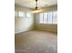Well-lit bedroom with large windows and a ceiling fan for comfortable living at 4286 E Buckboard Rd, Gilbert, AZ 85297