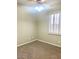 Comfortable carpeted bedroom with bright window bringing in natural light, with ceiling fan at 4286 E Buckboard Rd, Gilbert, AZ 85297