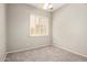 Simple bedroom with window and neutral carpet at 4286 E Buckboard Rd, Gilbert, AZ 85297