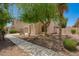 Inviting exterior showcasing desert landscaping, a charming facade, and a well-maintained walkway at 4286 E Buckboard Rd, Gilbert, AZ 85297