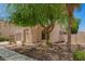 Inviting exterior showcasing desert landscaping, a charming facade, and a well-maintained walkway at 4286 E Buckboard Rd, Gilbert, AZ 85297