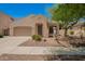 Charming single-story home with desert landscaping, a two-car garage, and a welcoming front entrance at 4286 E Buckboard Rd, Gilbert, AZ 85297