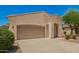Inviting single-story home with a two-car garage, desert landscaping, and a well-maintained walkway at 4286 E Buckboard Rd, Gilbert, AZ 85297