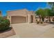Inviting single-story home with a two-car garage, desert landscaping, and a well-maintained walkway at 4286 E Buckboard Rd, Gilbert, AZ 85297