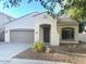 A well-maintained single-story home featuring desert landscaping and an arched entry at 4286 E Buckboard Rd, Gilbert, AZ 85297