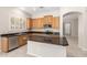 Charming kitchen equipped with granite counters, stainless appliances, island, and ample wood cabinetry at 4286 E Buckboard Rd, Gilbert, AZ 85297