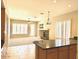Open living space with fireplace and large windows and view from the kitchen area, blending style and functionality at 4286 E Buckboard Rd, Gilbert, AZ 85297