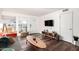 Inviting living room featuring a large window, modern TV console, and stylish decor at 4924 N 73Rd St # 11, Scottsdale, AZ 85251