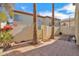 The home's backyard features a tiled patio with palm trees and other lush landscaping at 5018 E Siesta Dr # 3, Phoenix, AZ 85044