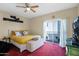 Bedroom featuring a bed, sliding glass door, and bright natural light, offering a restful retreat at 5018 E Siesta Dr # 3, Phoenix, AZ 85044