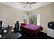 Bedroom featuring a plush bed, natural light, and ceiling fan, offering a space for relaxation and rest at 5018 E Siesta Dr # 3, Phoenix, AZ 85044