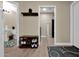 Hallway view featuring coat racks, shoe storage, and doorways leading to other rooms at 5018 E Siesta Dr # 3, Phoenix, AZ 85044