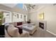 Bright living room with vaulted ceilings, fireplace, and large sectional sofa at 5018 E Siesta Dr # 3, Phoenix, AZ 85044