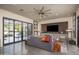 Bright and airy living room showcasing comfortable seating, a brick accent wall, and sliding doors at 5045 N 22Nd St, Phoenix, AZ 85016