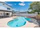 Sparkling swimming pool and spa create an ideal backyard oasis for relaxing and entertaining guests at 5101 E Winchcomb Dr, Scottsdale, AZ 85254