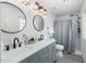Bright bathroom featuring a double vanity, modern fixtures, and a walk-in shower at 5101 E Winchcomb Dr, Scottsdale, AZ 85254
