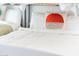 Comfortable bedroom features a well-made bed with geometric accent pillows and natural light at 5101 E Winchcomb Dr, Scottsdale, AZ 85254