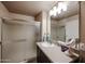 Bathroom with a large mirror, modern lighting, and a glass-enclosed shower at 5450 E Deer Valley Dr # 2193, Phoenix, AZ 85054