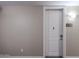 Apartment front door with unit number, detailed trim, modern lock, and neutral-colored walls at 5450 E Deer Valley Dr # 2193, Phoenix, AZ 85054