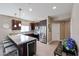 Modern kitchen with stainless steel appliances, dark wood cabinets, and an island with seating at 5450 E Deer Valley Dr # 2193, Phoenix, AZ 85054
