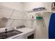 Well-organized laundry room with modern washer and dryer and ample shelving at 5450 E Deer Valley Dr # 2193, Phoenix, AZ 85054