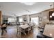 Open-concept living and dining area with abundant natural light, tile floors, and modern furnishings at 5450 E Deer Valley Dr # 2193, Phoenix, AZ 85054