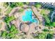 Aerial view of community pool with lush landscaping, and surrounding buildings at 5450 E Deer Valley Dr # 2193, Phoenix, AZ 85054
