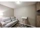 A comfortable sitting area with a modern sofa, table, and built in storage cabinets at 5450 E Deer Valley Dr # 2193, Phoenix, AZ 85054