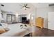 Spacious main bedroom features hardwood floors, a ceiling fan, and natural light at 5936 W Park View Ln, Glendale, AZ 85310