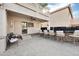 Covered patio featuring a wet bar, seating, and outdoor TV, perfect for outdoor entertainment and relaxation at 5936 W Park View Ln, Glendale, AZ 85310