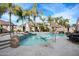 Beautiful backyard pool with a rock waterfall and lush tropical landscaping providing a luxurious outdoor living experience at 5936 W Park View Ln, Glendale, AZ 85310