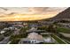 From an aerial view, bask in sunset views from this home’s pool, spa, and nearby golf course at 6302 E Hillcrest Blvd, Scottsdale, AZ 85251