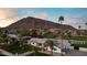 Aerial view of a single-story home with mountain views and palm trees at 6302 E Hillcrest Blvd, Scottsdale, AZ 85251