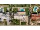An aerial view highlights this property's pool, putting green, impeccable landscaping, and proximity to neighboring homes at 6302 E Hillcrest Blvd, Scottsdale, AZ 85251