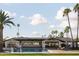 Stunning backyard featuring a pool, patio, lush lawn, and mature palm trees at 6302 E Hillcrest Blvd, Scottsdale, AZ 85251