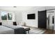 Guest bedroom with a black barn door and en-suite bathroom at 6302 E Hillcrest Blvd, Scottsdale, AZ 85251