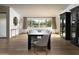 Elegant dining room with a large dark wood table and white chairs at 6302 E Hillcrest Blvd, Scottsdale, AZ 85251