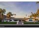 A classic and contemporary home boasts mature trees and a spacious front lawn at 6302 E Hillcrest Blvd, Scottsdale, AZ 85251