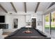Stylish game room featuring a pool table, fireplace, and built in bar area at 6302 E Hillcrest Blvd, Scottsdale, AZ 85251
