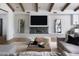 Cozy living room with fireplace, modern furniture, and hardwood floors at 6302 E Hillcrest Blvd, Scottsdale, AZ 85251