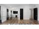 Spacious living room featuring hardwood floors, wainscoting, and stylish modern decor at 6302 E Hillcrest Blvd, Scottsdale, AZ 85251