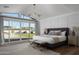 Main bedroom with sliding glass doors opening to the backyard at 6302 E Hillcrest Blvd, Scottsdale, AZ 85251