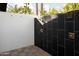 Outdoor shower with dark tile and modern fixtures at 6302 E Hillcrest Blvd, Scottsdale, AZ 85251
