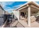 Cozy covered patio featuring comfortable seating, television, grill, and a nice view at 650 N Hawes Rd # 2872, Mesa, AZ 85207