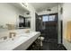 Modern bathroom featuring double vanity, frameless shower, and sleek fixtures at 6531 N 81St Pl, Scottsdale, AZ 85250