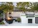 Modern outdoor kitchen with a built-in grill, counter space, and dining area for easy entertaining at 6531 N 81St Pl, Scottsdale, AZ 85250